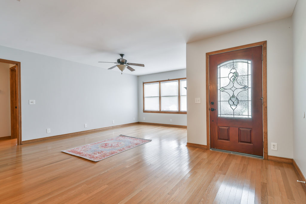 Spacious living area with nice oak floors.